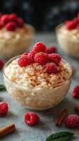 Delicious rice pudding topped with raspberries and cinnamon in a cozy kitchen setting photo