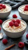 Creamy rice pudding topped with fresh raspberries in cozy kitchen setting photo