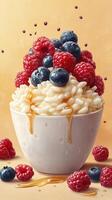 Delicious bowl of creamy rice pudding topped with fresh berries and drizzled with honey photo