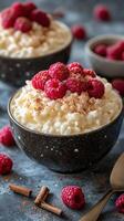 Creamy dessert topped with fresh raspberries and a sprinkle of cinnamon in cozy kitchen setting photo