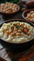 Delicious creamy dessert with nuts and spices served in a rustic bowl at a cozy dining setting photo