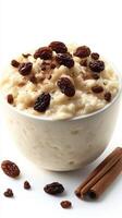 Creamy rice pudding topped with raisins and sprinkled with cinnamon photo