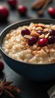 Creamy oatmeal topped with berries, nuts, and spices in a rustic kitchen setting during autumn photo