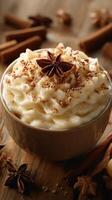 Creamy whipped dessert topped with spices and herbs in a cozy setting with rustic wooden texture photo