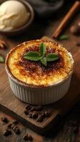 Delicious dessert featuring creamy custard topped with caramelized sugar and fresh mint in a rustic setting photo