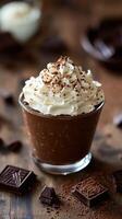 Delicious chocolate mousse topped with whipped cream and cocoa on a wooden table in a cozy setting photo