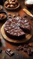 Deliciously rich chocolate cake with almonds and coconut flakes served on a rustic wooden table photo
