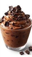 Creamy chocolate mousse topped with dark chocolate shavings served in a clear glass bowl photo