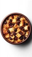 Delicious bread pudding with chocolate chips and a golden crust served in a rustic bowl photo