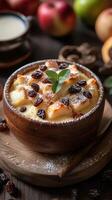 Delightful bread pudding with raisins and mint served in a rustic wooden bowl surrounded by fresh fruit photo