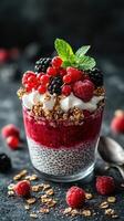 Delicious berry parfait layered with yogurt, granola, and fresh fruits on a dark background photo
