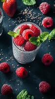 Fresh raspberry chia pudding served in a glass with mint leaves on a dark background, perfect for a healthy dessert or snack photo