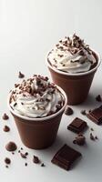 Creamy chocolate dessert topped with whipped cream and chocolate shavings in a stylish setting photo