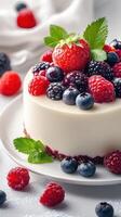 Decadent cake topped with fresh berries and mint on a white plate in a bright kitchen setting photo