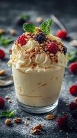Delicious dessert served in a glass with whipped cream, fresh berries, and nuts atop a rich base photo