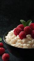 Fresh raspberries on creamy cottage cheese in a dark setting showcasing a delicious dessert selection photo