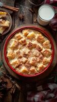 Delicious bread pudding topped with cinnamon in a rustic kitchen setting with milk photo
