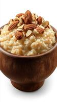 Warm oatmeal topped with roasted almonds served in a wooden bowl for a nutritious breakfast photo