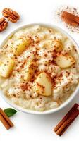 Delicious rice pudding topped with fresh apple slices and sprinkled with cinnamon in a cozy kitchen setting photo