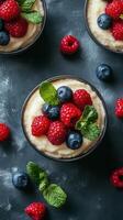 Delicious dessert bowls topped with fresh raspberries, blueberries, and mint on a dark background photo