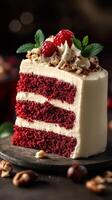 Delicious red velvet cake slice with cream frosting and fresh raspberries on a dark wooden background photo