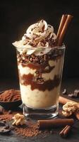 Indulgent dessert treat featuring creamy layers, chocolate, and crunchy toppings in an exquisite glass presentation photo