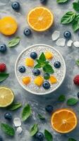 Delicious chia seed pudding topped with fresh fruit displayed on a textured surface photo