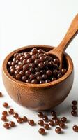 Delicious sweet tapioca pearls served in a rustic wooden bowl with a wooden spoon photo