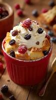 Delicious bread pudding topped with whipped cream and fresh berries in a cozy kitchen setting photo