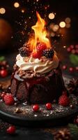 Warm chocolate cake topped with berries and flaming dessert sauce during a festive celebration photo