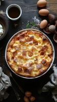 Delicious homemade bread pudding with eggs and spices on a rustic wooden table photo