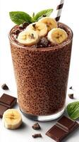 Creamy chocolate banana smoothie with fresh toppings and dark chocolate pieces photo