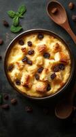 Delicious homemade bread pudding with raisins and mint garnish prepared in a rustic kitchen setting photo