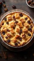 Delicious bread pudding with raisins and golden crust served on wooden surface, ideal for dessert lovers photo