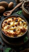 Warm dessert with creamy texture and golden crust topped with raisins and garnished with mint leaves photo