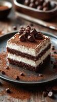 Delicious chocolate dessert served on a dark plate with cocoa powder and coffee beans in a cozy kitchen setting photo