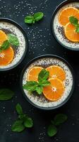 Refreshing chia seed pudding bowls topped with fresh oranges and mint at a modern kitchen setting photo