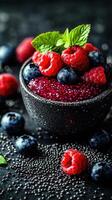 Fresh berry bowl filled with raspberries, blueberries, and chia seeds on a dark background photo