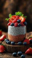 Delicious chia seed pudding topped with fresh berries on a rustic wooden table photo