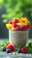 Delicious chia seed pudding topped with fresh fruit in a glass dessert cup on a wooden table photo