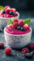 Refreshing berry chia pudding served in bowls with fresh fruits and mint garnishing for a delightful dessert photo