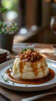 Delicious dessert with caramel sauce and crunch topping served in a cozy cafe photo