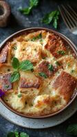 Delicious bread pudding topped with fresh mint leaves presented in a rustic setting photo