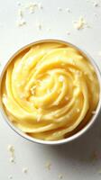 Creamy lemon curd in a bowl with a smooth texture on a light background photo