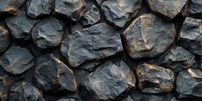 Varied textures of natural stones create a rugged surface in a close-up view showcasing their unique shapes and colors photo