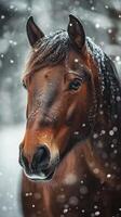 Majestic brown horse with snowflakes on its fur in a winter wonderland setting photo