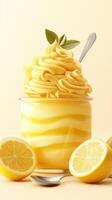 Delightful lemon sorbet in a glass topped with creamy swirl and garnished with a leaf, accompanied by fresh lemon slices photo