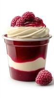 Delightful raspberry dessert served in a cup with layers of creamy texture and a rich topping photo