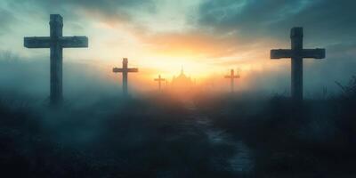 Misty graveyard at sunrise with silhouetted crosses and a church in the background photo