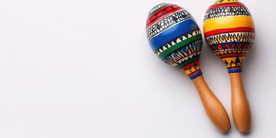 Colorful maracas placed side by side on a light surface showcasing traditional craftsmanship and vibrant patterns photo